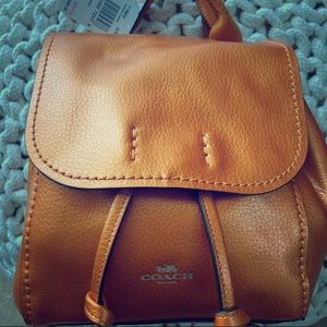 Rare metallic tangerine Coach mini backpack